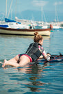 A Shadow Jetboard rider wearing an Awake Life Vest while on the board.