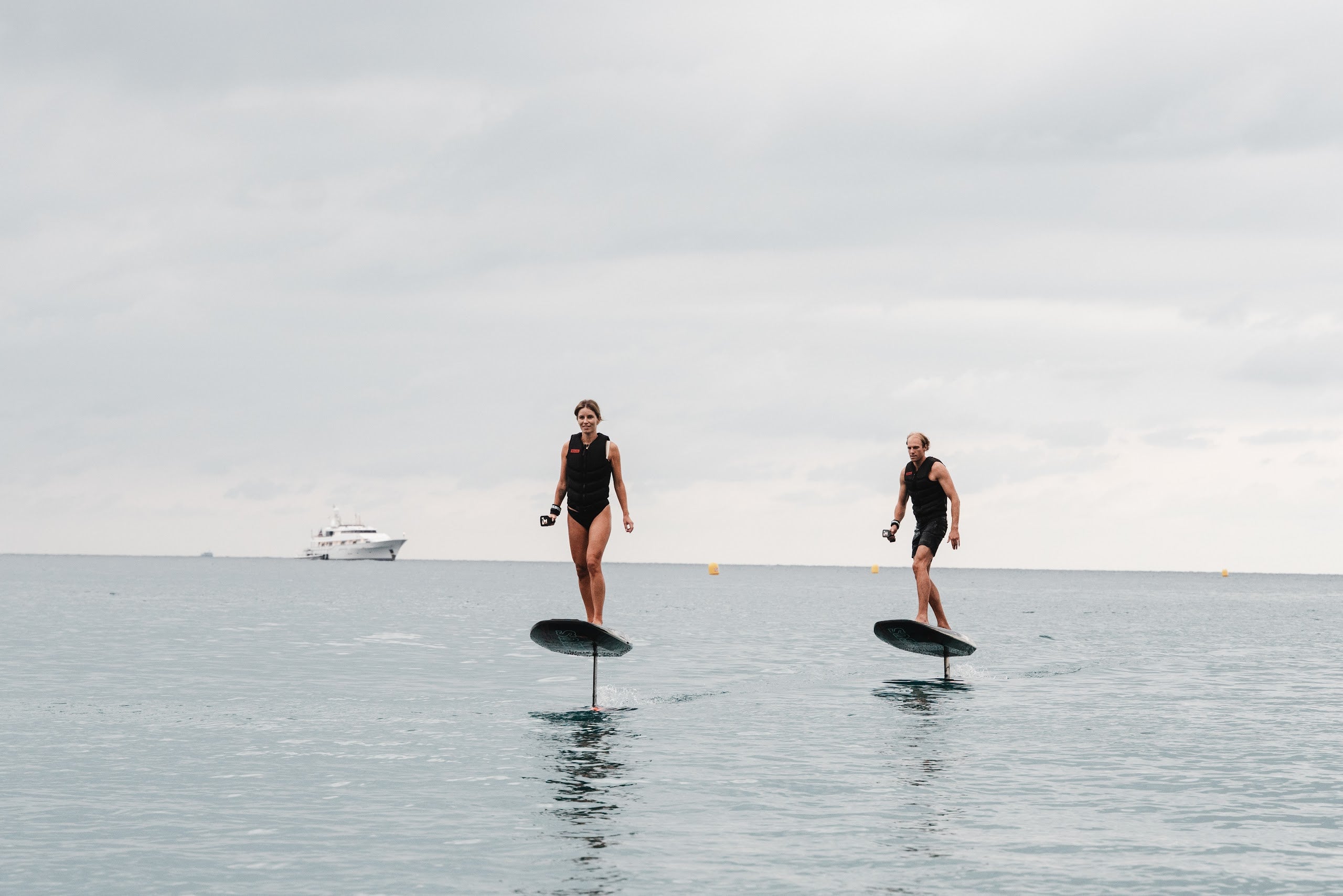 Two riders foiling on BRABUS x Awake SHADOW CARVE eFoils