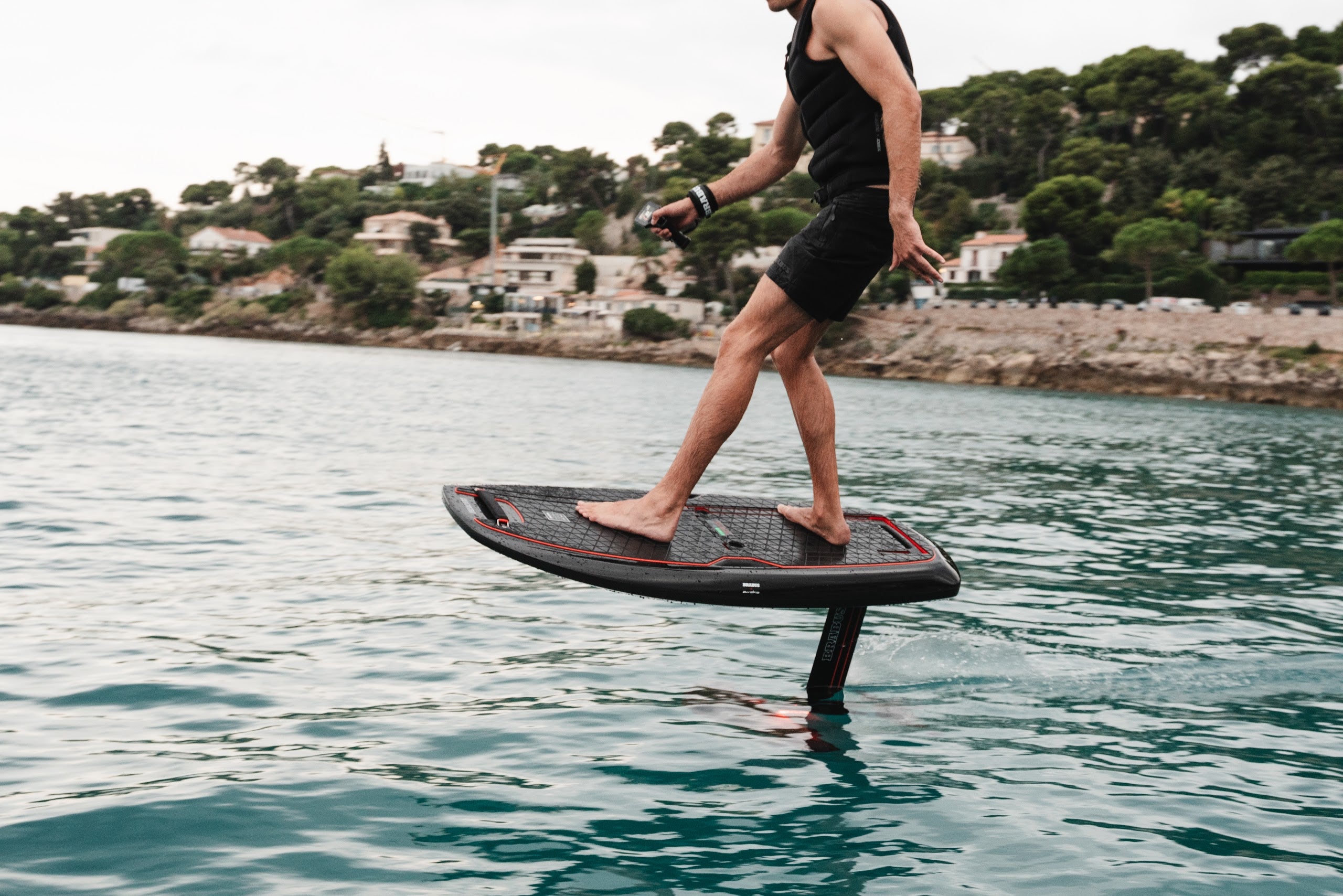 Rider stepping across the BRABUS x Awake SHADOW CARVE deck