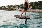 Rider stepping across the BRABUS x Awake SHADOW CARVE deck