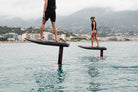 Two BRABUS x Awake SHADOW CARVE eFoils riding along the Monaco coast